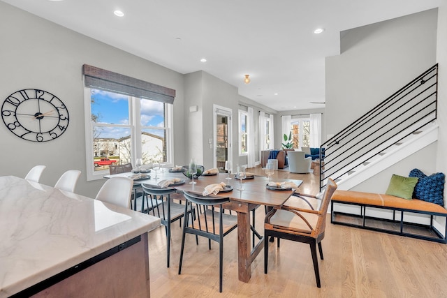 dining room featuring plenty of natural light and light hardwood / wood-style floors