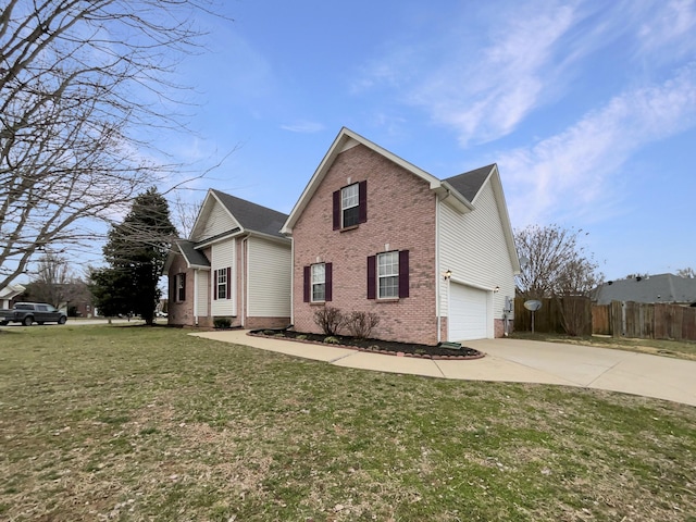 view of side of property with a yard and a garage