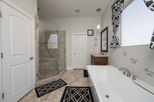 full bathroom featuring a stall shower, a freestanding tub, and vanity