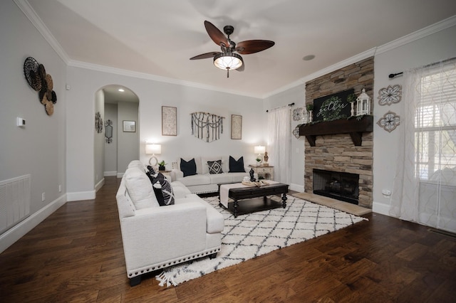 living area with arched walkways, visible vents, crown molding, and wood finished floors