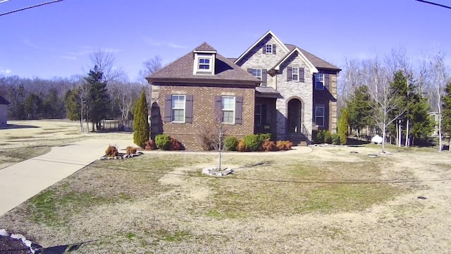 view of front facade with stone siding and brick siding