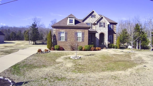 view of front of house featuring stone siding and brick siding