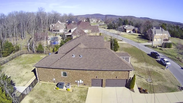 birds eye view of property with a residential view