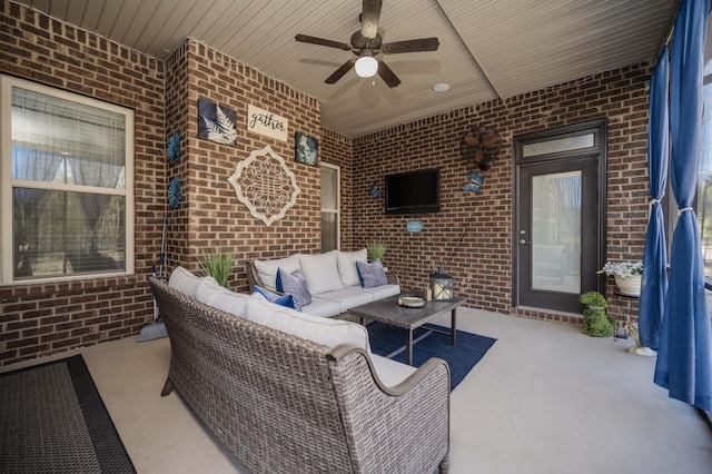 view of patio with outdoor lounge area and a ceiling fan