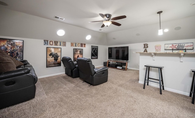 living room featuring light colored carpet, visible vents, lofted ceiling, and baseboards