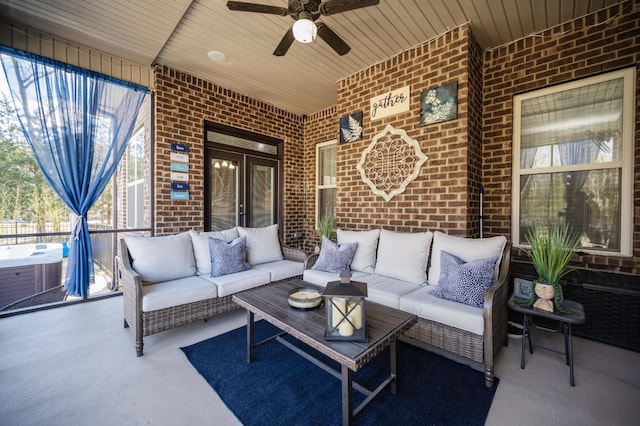 view of patio with an outdoor living space, central AC unit, and a ceiling fan