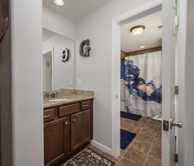 full bathroom featuring baseboards, visible vents, a shower with shower curtain, tile patterned flooring, and vanity