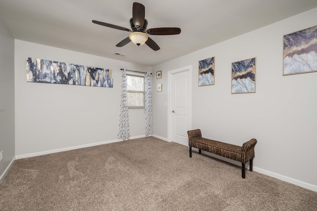 interior space with ceiling fan, carpet flooring, visible vents, and baseboards