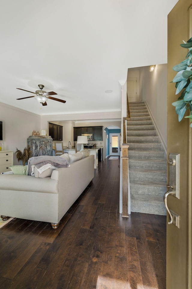 living room featuring dark hardwood / wood-style floors and ceiling fan