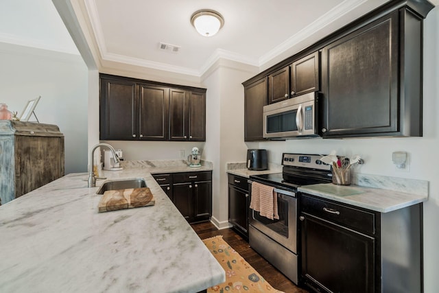 kitchen with crown molding, stainless steel appliances, dark wood-type flooring, and sink