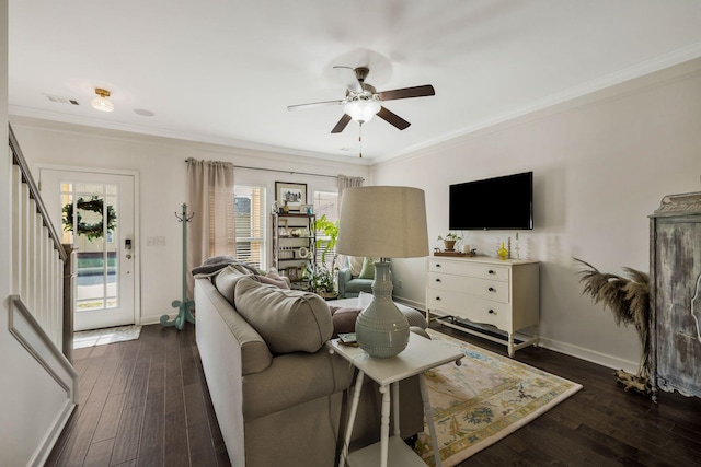 living room with crown molding and dark hardwood / wood-style flooring