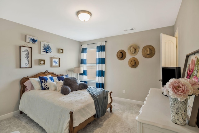 bedroom featuring light carpet