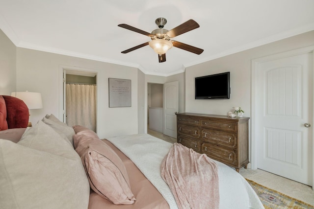 bedroom featuring ceiling fan, crown molding, and light colored carpet