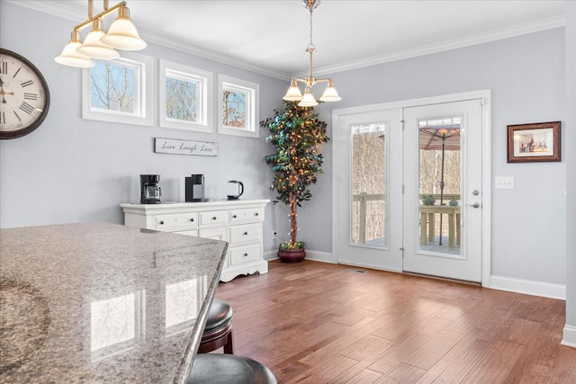 7144 Triple Crown Ln, Fairview, TN 37062 - dining room with crown molding, dark wood finished floors, and baseboards