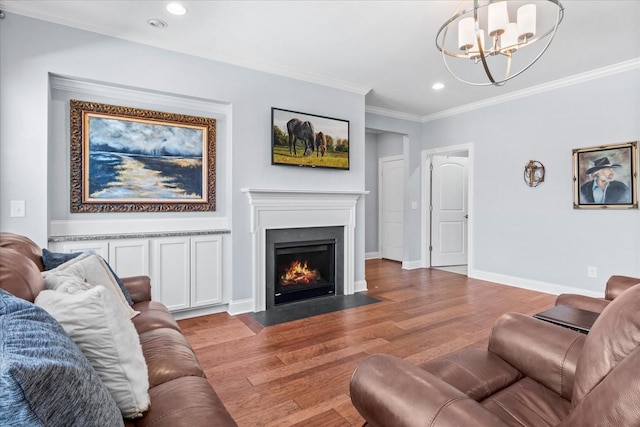 7144 Triple Crown Ln, Fairview, TN 37062 - living area featuring baseboards, a fireplace with flush hearth, ornamental molding, wood finished floors, and recessed lighting