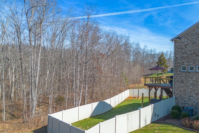 7144 Triple Crown Ln, Fairview, TN 37062 - view of yard featuring a fenced backyard, central AC unit, and a wooded view