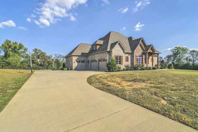 view of front of property featuring a garage and a front yard