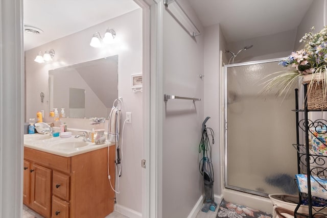 bathroom featuring vanity and walk in shower