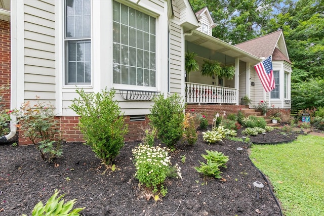 view of home's exterior with covered porch