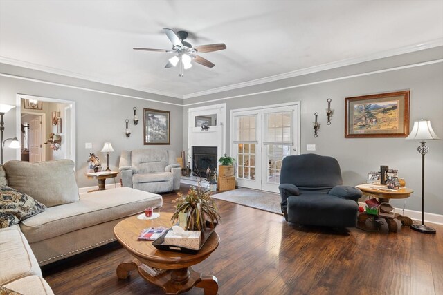 living room with ornamental molding, dark wood-type flooring, french doors, and ceiling fan