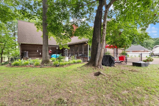 view of yard featuring a sunroom