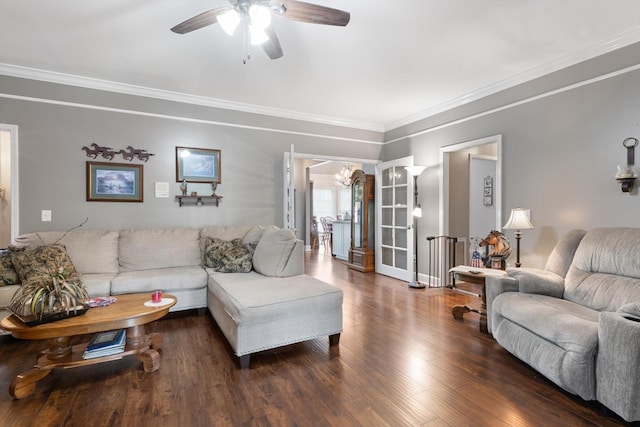 living room with ceiling fan, ornamental molding, and dark hardwood / wood-style floors