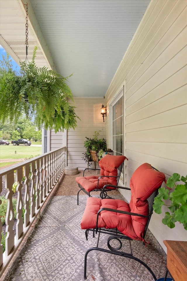 balcony featuring a porch