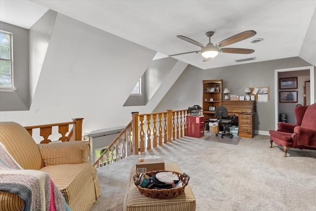 interior space featuring lofted ceiling, ceiling fan, and carpet floors