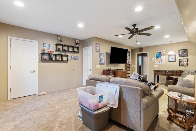 carpeted living room featuring ceiling fan