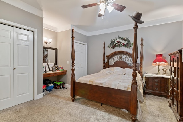 bedroom with ceiling fan, crown molding, and light colored carpet