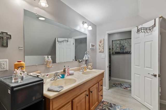 bathroom featuring vanity and wood-type flooring