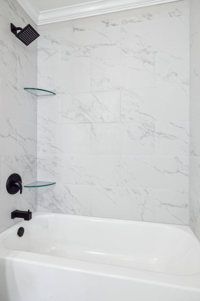 full bathroom featuring ornamental molding and bathing tub / shower combination