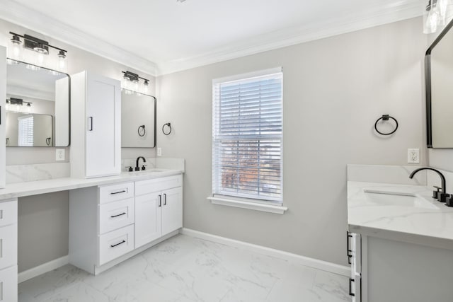 full bathroom featuring two vanities, a sink, baseboards, marble finish floor, and ornamental molding