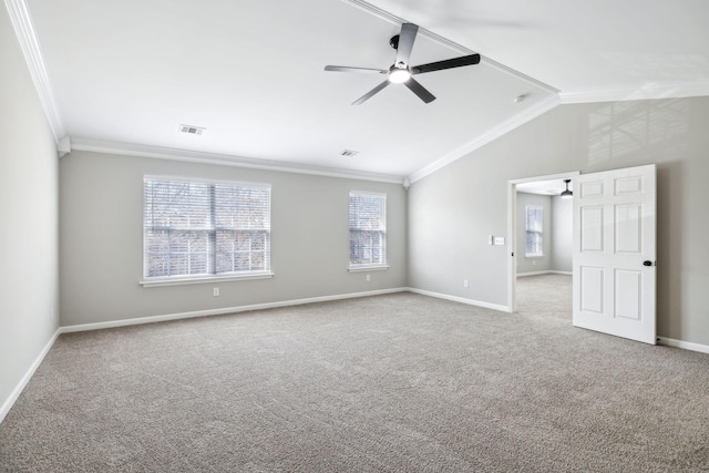 empty room with light colored carpet, visible vents, crown molding, and lofted ceiling