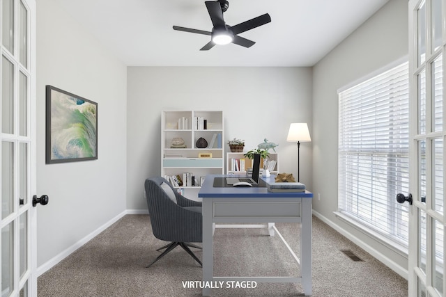 home office featuring carpet floors, french doors, visible vents, and baseboards