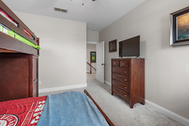 bedroom with light carpet