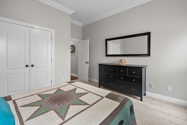 bedroom featuring ornamental molding, a closet, and light colored carpet