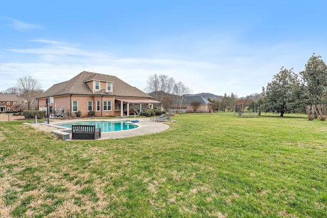 back of house featuring a yard and a patio area