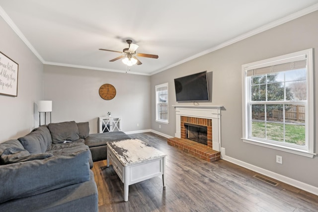 living room with ceiling fan, crown molding, dark hardwood / wood-style floors, and a healthy amount of sunlight