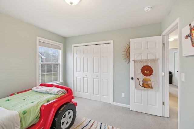 carpeted bedroom with a closet