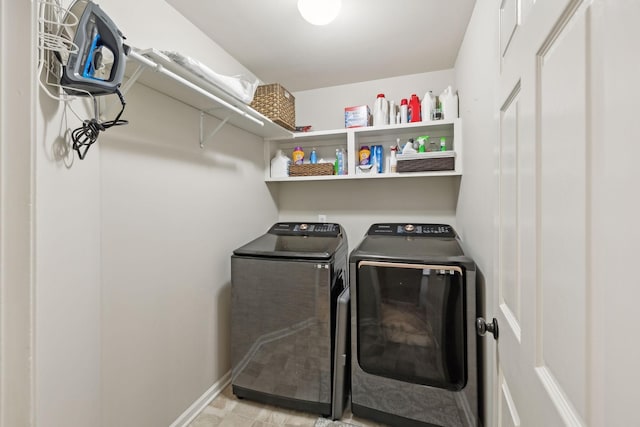 clothes washing area with independent washer and dryer