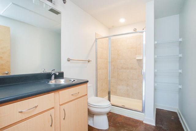 bathroom featuring vanity, toilet, and walk in shower