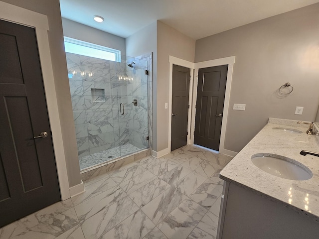 full bathroom featuring baseboards, marble finish floor, a sink, and a shower stall