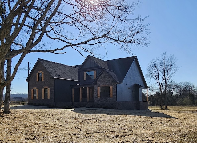 view of front facade featuring stone siding