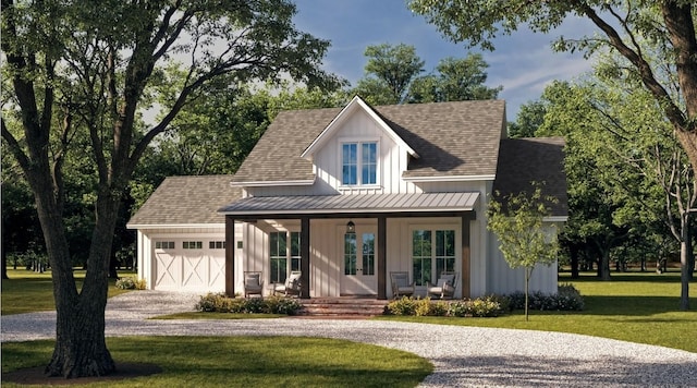 view of front of house with a garage, a front yard, covered porch, and gravel driveway