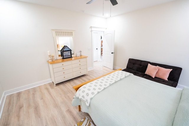 bedroom with light hardwood / wood-style flooring and ceiling fan