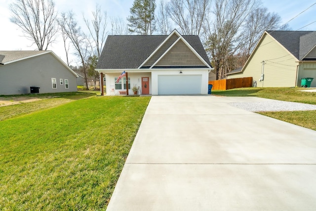 view of front of home featuring covered porch, a front yard, and a garage