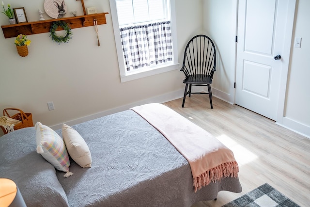 bedroom with light hardwood / wood-style floors