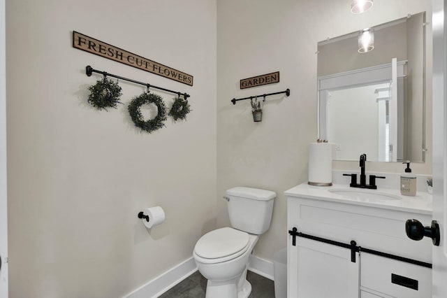 852 Pine Grove Rd, Ringgold, GA 30736 - bathroom with toilet, vanity, and baseboards
