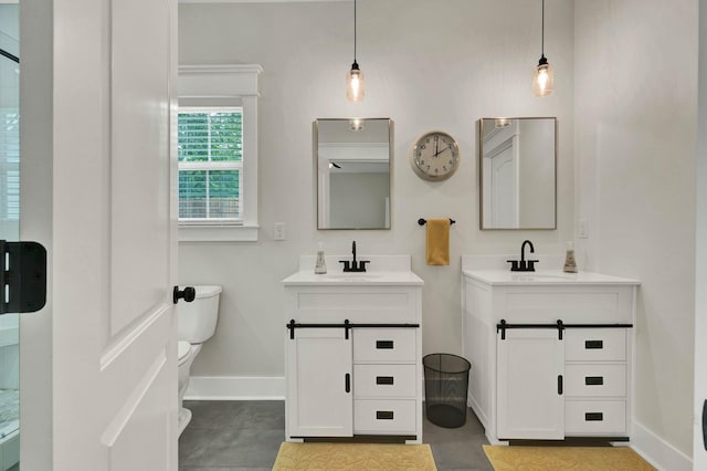 852 Pine Grove Rd, Ringgold, GA 30736 - full bathroom with baseboards, two vanities, and toilet